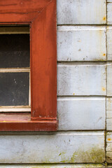 Window frame in a wooden house of an old German construction - a fragment of the built-in