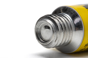 Close up shot of thread on metal tube and it's seal. sealed metal tube. 
