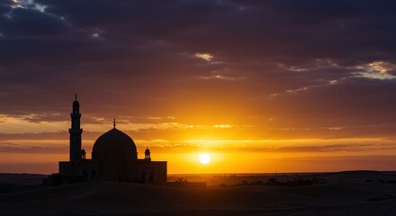 Obraz premium Majestic silhouette of a mosque against the backdrop of a stunning sunset sky