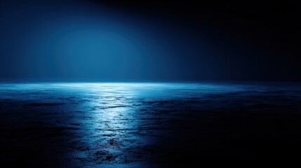 Serene ocean surface illuminated by moonlight with dark cloudy night sky.