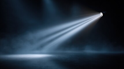 Illuminating bright flashlight beam projecting strong light into dark night sky with mist.