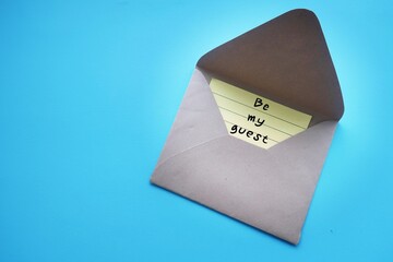 Envelope with note written BE MY GUEST - to give someone polite permission - saying yes to request...