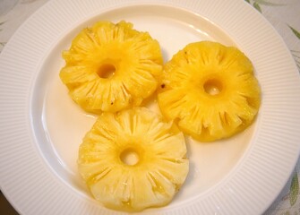 Pineapple rings on white plate