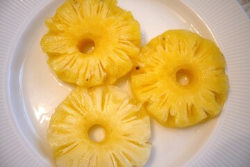 Pineapple rings on white plate