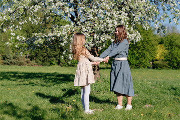 Fototapeta premium Summer fun. Mother and daughter in nature.