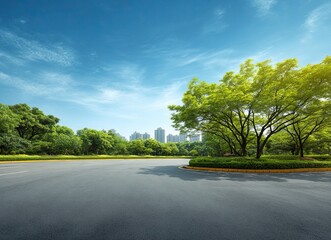 Empty asphalt road and green trees with a blue sky background in a Shanghai city park, suitable for car advertising, copy space, and banner design.