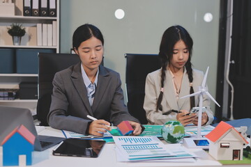 Asian woman lead young group of multiethnic businesspeople in team meeting, using laptop computer for ESG topic presentation on monitor. Sustainable business practice, people work at home concept
