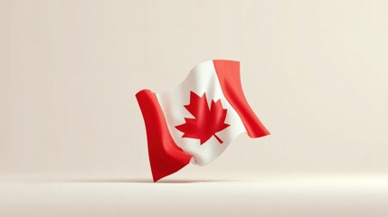 Small Canadian flag waving in the air with a plain light background and soft lighting.