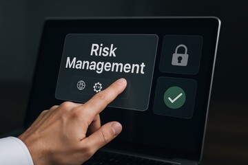Hand pointing at risk management option on a laptop screen.