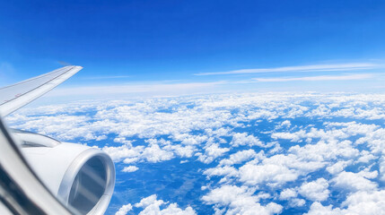Stunning aerial view of blue sky with fluffy clouds from an airplane window
