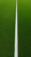Obraz premium Thick horizontal white painted line is running across green grass turf in flat vector illustration, a well-maintained green grass field with a thick white line running horizontally across the center.
