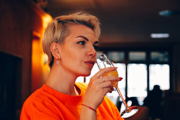 woman drinking cocktail