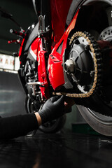 Motorcycle chain maintenance is essential for smooth riding and drivetrain longevity. Chain tuning improves torque delivery and rear performance. Chain tensioning at motorcycle maintenance service.
