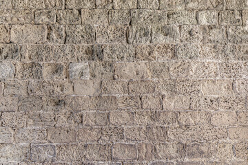 abstract background of an old stone wall close up