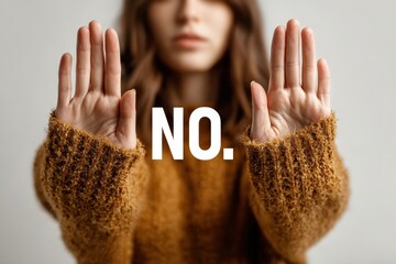 Hands stopping gently in a non-verbal "no" gesture with a peaceful face in focus