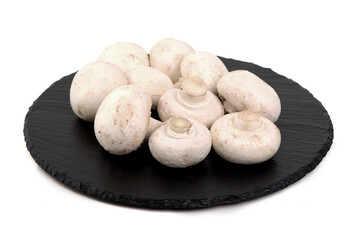 White Mushrooms on Slate, isolated on white background