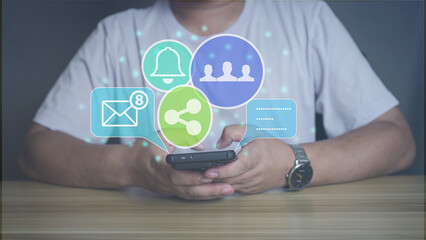 Man using smartphone with social media icons overlay. Concept of digital marketing, online communication, notification, and social network engagement.