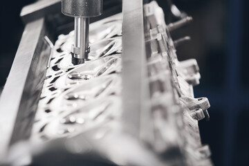 Engine Valve Seat Repair in car workshop close up.