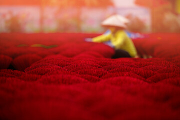 Incense stick production in vietnamese village: vibrant red sticks in rural setting