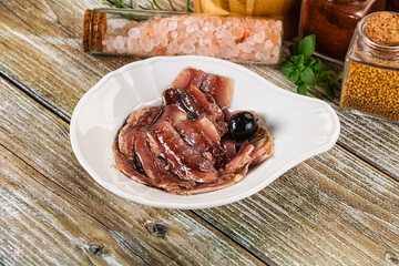 Canned anchovy with oil in the bowl