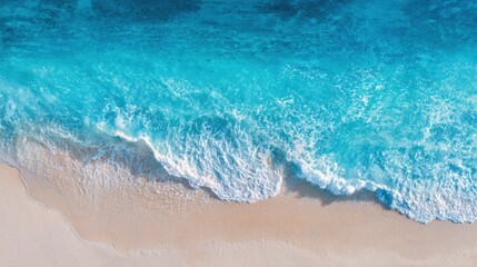 Tranquil Beach Scene with Clear Blue Ocean Waves and Soft Sandy Shoreline.