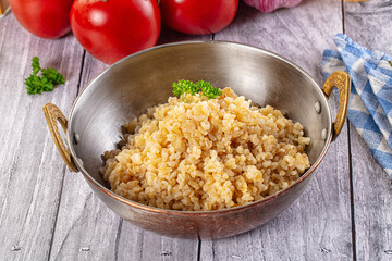 Vegan cuisine - boiled bulgur garnish
