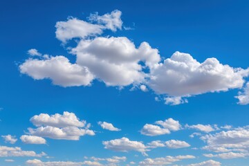 Fototapeta premium Vast blue sky dotted with puffy white clouds (1)