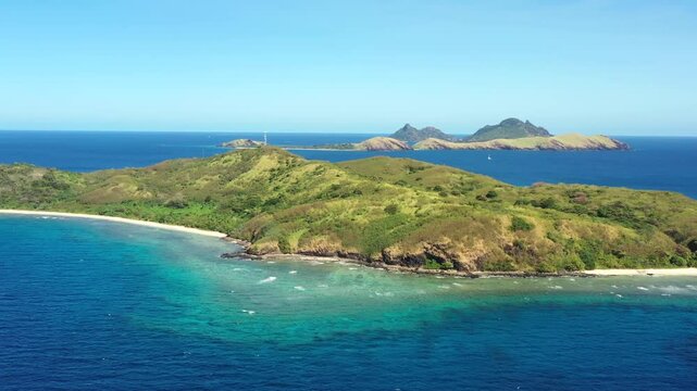Scenic Tokoriki island surrounded by coral reefs in Pacific ocean at Fiji islands aerial 4k.
