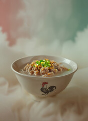Hearty bowl of Asian pork gruel or congee, topped with fresh scallions and crunchy fried garlic, presented in a rustic ceramic bowl.
