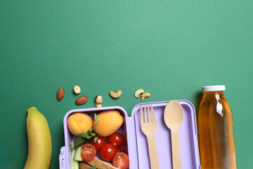 healthy lunch box with school backpack, apple and stationery on color background