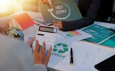 Asian woman lead young group of multiethnic businesspeople in team meeting, using laptop computer for ESG topic presentation on monitor. Sustainable business practice, people work at home concept