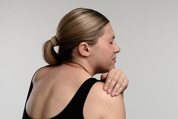 A Woman Experiencing Shoulder Discomfort and Pain Relief in Daily Life