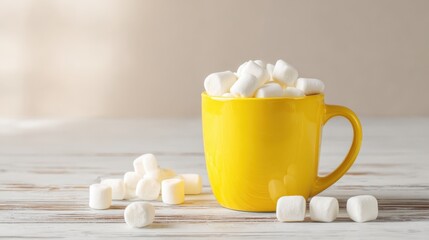 Bright Yellow Coffee Mug Filled With Mini Marshmallows Placed on Wooden Surface.