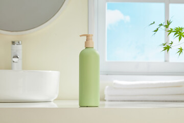 Simple bathroom shelf with green soap pump bottle and white rolled towels beside a round mirror. Bright, modern, and perfect for minimal skincare mockups or wellness visuals.
