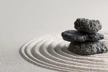 Photo sur Plexiglas Zen garden with smooth stones and sand patterns