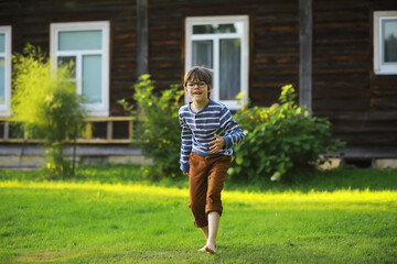 Happy little girl with flowers in the field
