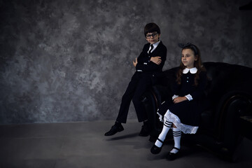 Obraz premium Uniformed schoolchildren posing for the camera in studio