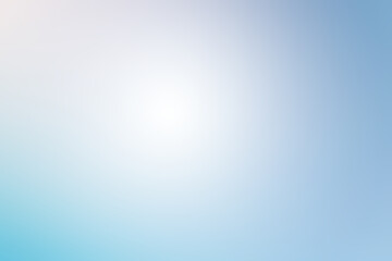 Abstract background of light blue shades with glare and bokeh effect.