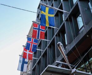 Flags of the Nordic countries: Sweden, Norway, Iceland, Denmark and Finland on the building