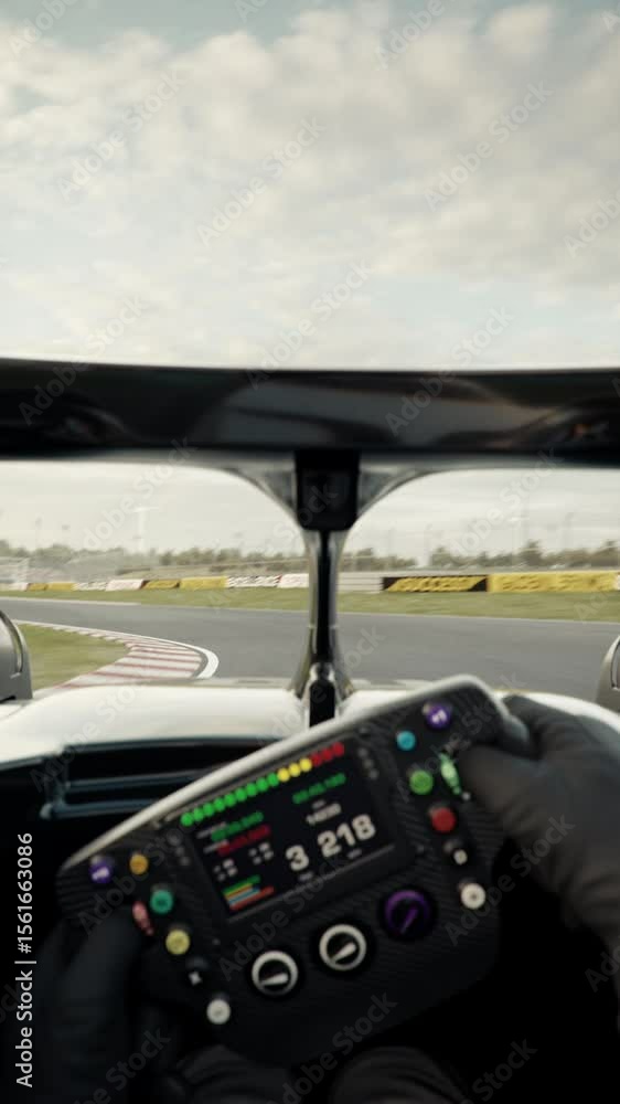 Fototapete pov shot of a race car doing a full lap on the track overtaking an opponent and crossing the finish 
