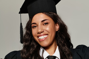 Young student celebrates graduation with a bright smile and stylish outfit in joyful moment
