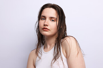 Portrait of beautiful woman with natural skin complexion on light grey background, closeup