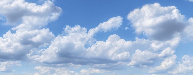 Obraz premium The beautiful fluffy clouds against a vibrant blue sky background.