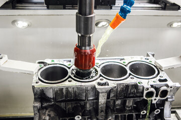 Work of Cylinder honing engine machine. Diamond boring of car details on CNC machine.