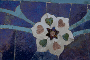 Samarkand , Uzbekistan 20 October, 2024: Guri Amir mausoleum closeup of tile mosaic of a flower