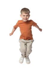 Happy little boy dancing on white background