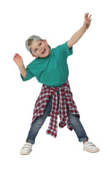 Happy little boy dancing on white background