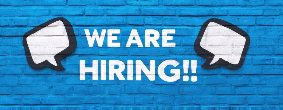 The Bold Message on a Vibrant Blue Wall Announcing Job Opportunities