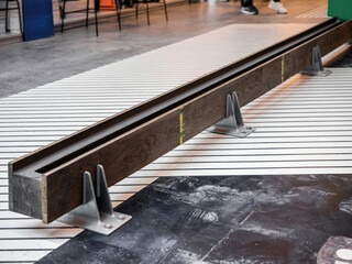 Monochrome Modern Interior with Wooden Beam and Geometric Floor Design