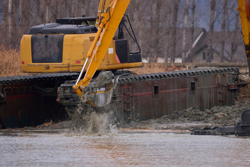 an excavator while draining a river